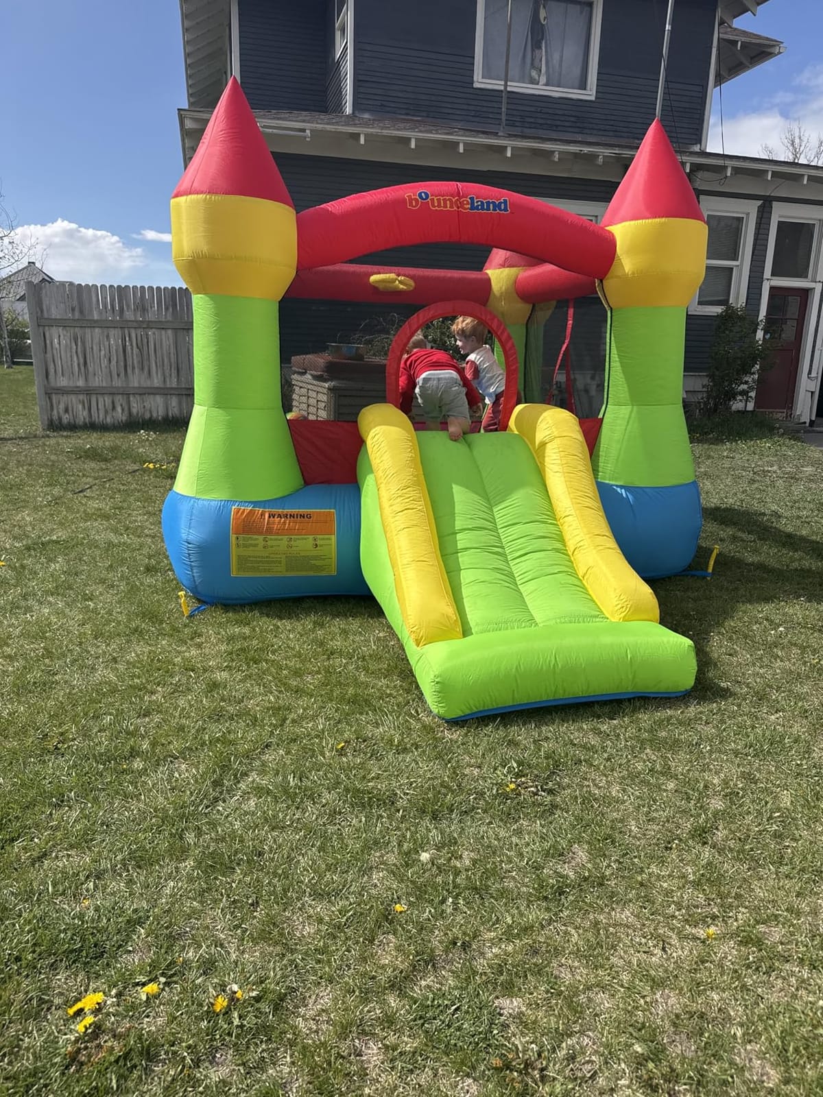 Bounceland Bounce House Castle with Basketball Hoop Inflatable Bouncer, Fun Slide, Safe Entrance Opening, UL Certified Strong Blower Included, 12 ft x 9 ft x 7 ft H customer photo 2
